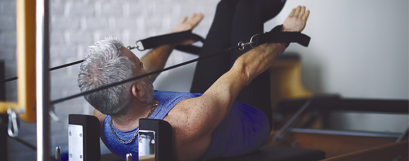 Older adult exercising indoors